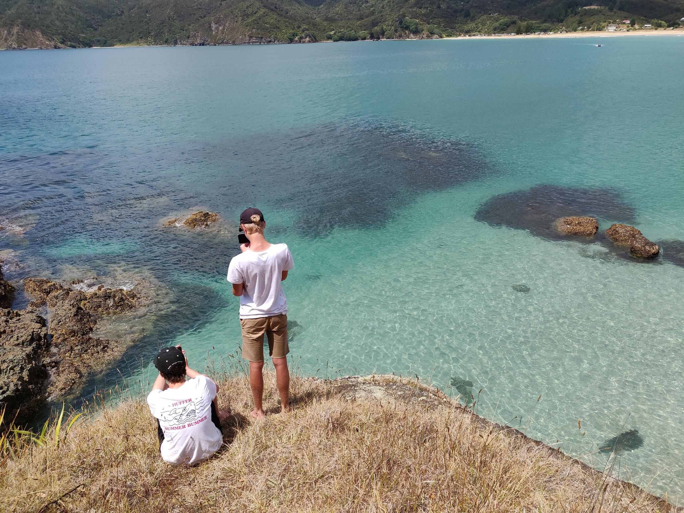 image of two cousins standing admiring the landscape in front of them