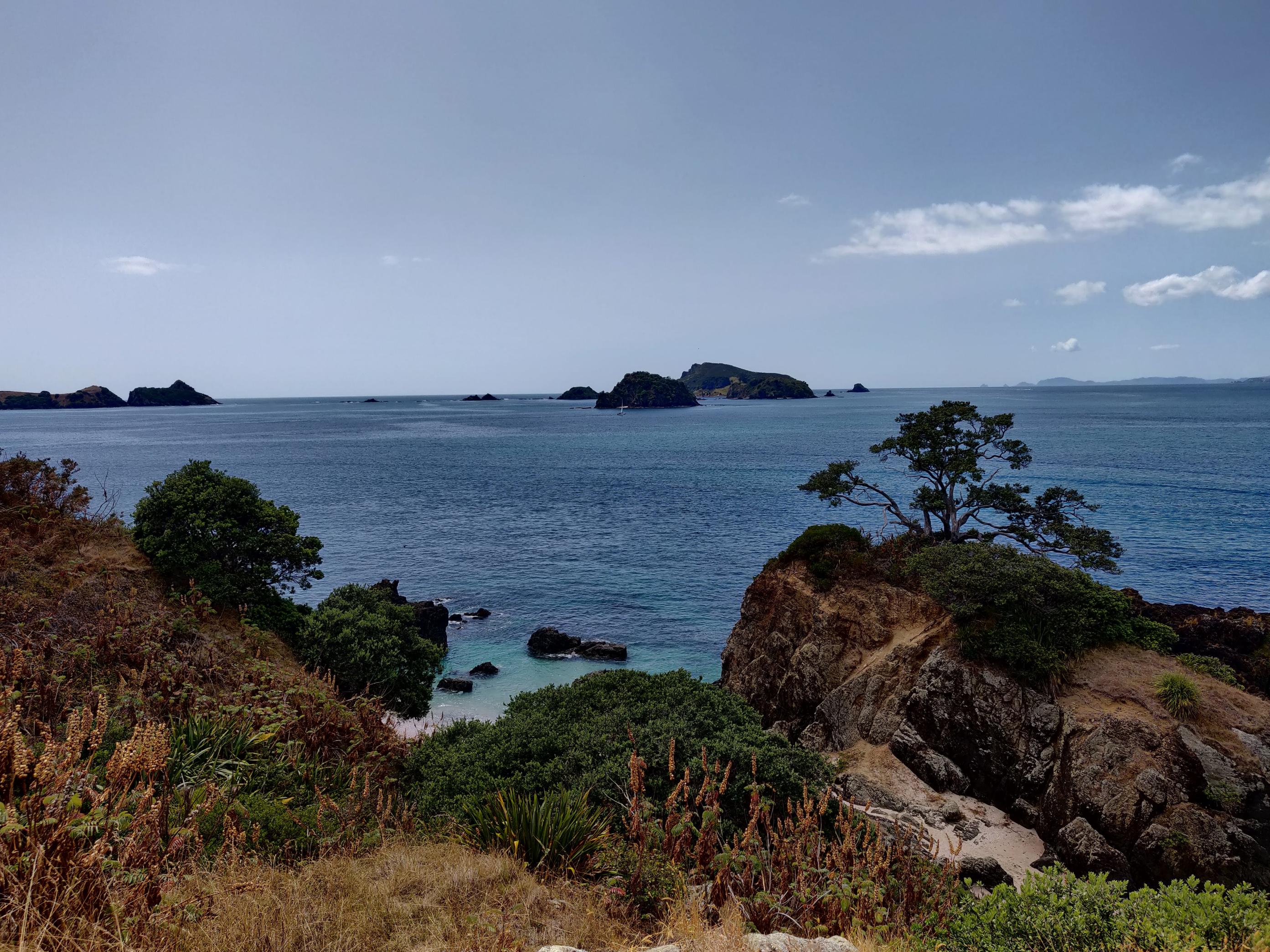 image of the ocean with islands dotted in the distance